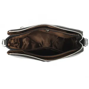 Black small square shoulder bag with multiple compartments, top zipper and brown lining.