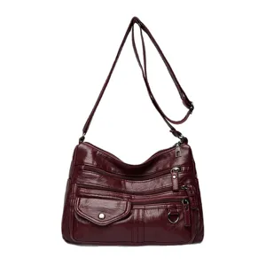 Wine red PU leather multi-pocket shoulder crossbody bag for women, stylish and practical design.