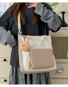 Cute cat canvas tote bag with bear pendant, large capacity college style shoulder bag.