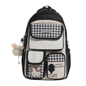 Cute multi-compartment student backpack in black and white plaid design with rabbit pendant.
