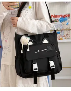 Cat ear canvas messenger bag detail view, large capacity student casual shoulder bag.