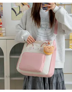 Cute cat color block canvas tote bag with plush bear pendant for school daily use.