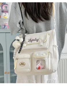 College style canvas shoulder bag, large capacity casual messenger bag for student daily use.
