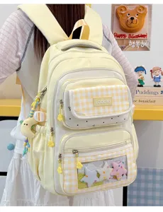 Cute yellow plaid school backpack with large capacity, clear ita bag window and charms for students.