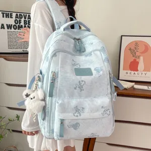 Light blue cute bear print school backpack with multiple compartments for student daily use.