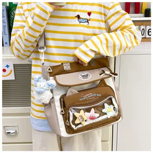 Cute canvas shoulder bag with clear front pocket, large capacity, ideal for students.