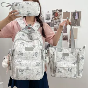 Cute cartoon bear print school backpack set with tote bag and pouch for students daily use.