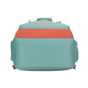 Backpack detail showing mint green fabric, vibrant orange color block, and cute text.