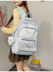 Light blue plaid and polka dot school backpack with cute pendant and embroidery design for students.