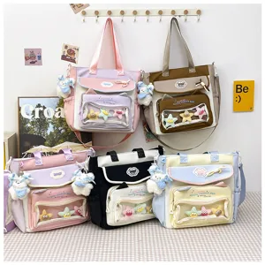 Cute canvas tote bag detail view showing transparent front pocket, colorful variants and cute charms.