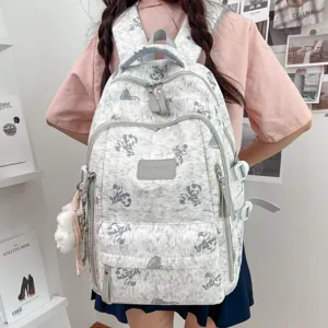 Detailed view of the Korean style cute teddy bear print school backpack with multiple compartments.