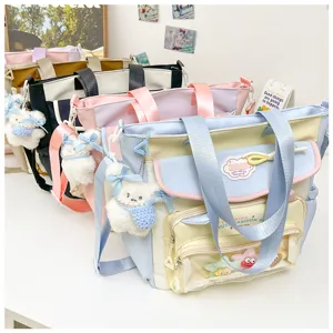 Details of the cute canvas tote bag with plush bunny pendant and transparent front pocket.