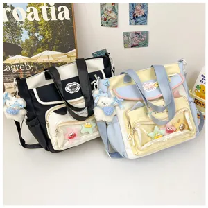 Cute student large capacity transparent shoulder bag, cram school bag with cute plush pendant details.