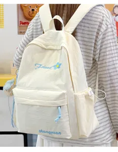 Casual solid color canvas backpack for women, lightweight school bag for daily travel use.