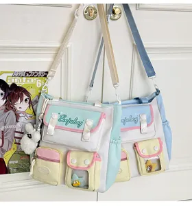 Detail view of Japanese college style canvas shoulder bag with multi pockets and pastel colors.