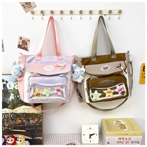 Cute canvas shoulder bag with transparent pocket, large capacity student cram school bag detail.