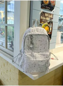 Korean ins style star print backpack with front pocket and cute star pendant for daily use.
