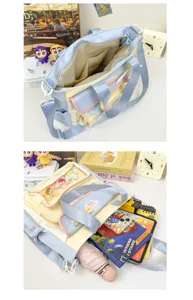 Cute multi-pocket canvas shoulder bag with large capacity, pastel design for students.