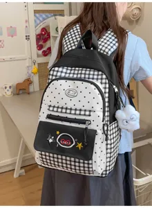 Black and white plaid backpack with cute polka dots, ideal for daily school and casual student use.