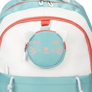 Close-up of cute cat shaped round pouch detail on a teal and white school backpack.
