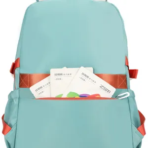 Casual blue canvas school backpack with red straps, stylish student rucksack for daily use.