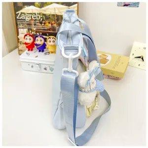 Cute light blue student canvas tote shoulder bag with fluffy bunny charm for daily school use.