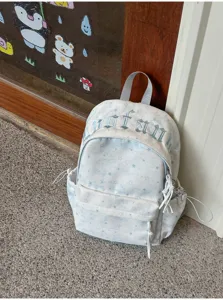Korean style star pattern canvas backpack casual school bag with front pocket and side storage