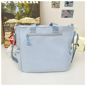 Cute large capacity blue shoulder bag student casual tote bag for daily school commuting.