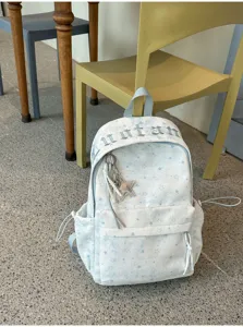 Korean style star pattern canvas backpack for students, large capacity school bag.