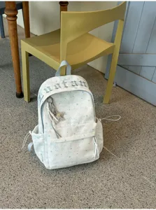 Detail shot of the Korean style star pattern backpack, showcasing trendy casual design.