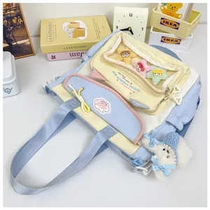 Cute multi-compartment canvas shoulder bag large capacity student cram school backpack.