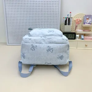 Light blue cute bear print school backpack for primary and middle school students daily use.