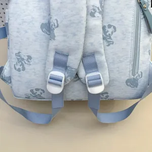 Light blue student backpack with cute cartoon print, adjustable straps and multi-pocket design.