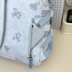 Light blue student backpack detail, cute cartoon bear print, multi-compartment school bag.