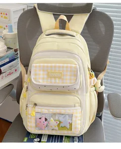Yellow plaid student backpack with transparent ita bag front pocket and large capacity storage.