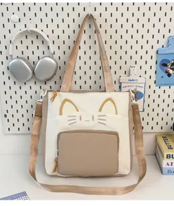 Canvas tote bag with cute cat embroidery, large capacity shoulder bag for daily commute.