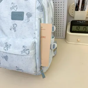 Light blue school backpack detail, cute bear print pattern, multi-compartment design.