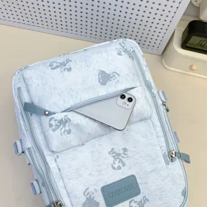Light blue cute bear print backpack with multi-compartments and front zipper pocket.