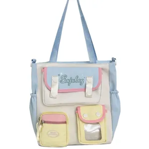 Japanese style large capacity canvas shoulder bag casual student tote bag with multiple pockets.
