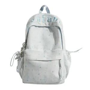 Korean style star pattern canvas backpack large capacity school bag for teen students daily use.