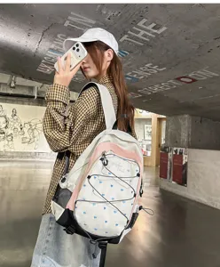 Sweet cool style pink and white heart print student backpack for campus commute and outdoor travel.