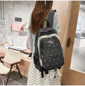 Sweet cool style student backpack with blue heart prints, casual daypack for campus commuting.