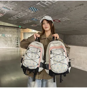 Pink and white heart print backpack detail view, cute casual daypack for campus commute.
