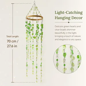 Light-catching hanging decor featuring green heart leaves and crystal beads with bamboo ring.