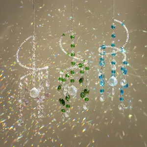 Close-up view of hanging crystal suncatchers casting vibrant rainbow light reflections.