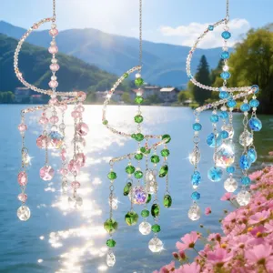 Crystal suncatcher detail, hanging spiral design with colorful multi-faceted prisms.