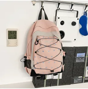 Pink heart print school backpack sweet cool style casual daypack for student daily commute.