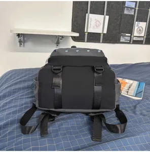 Detailed view of the stylish grey and black sweet-cool student backpack with cute heart accents.