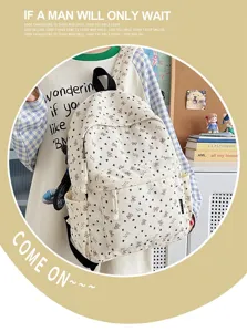 Detailed view of the cute corduroy backpack with bow pattern, shown in daily use scenario.