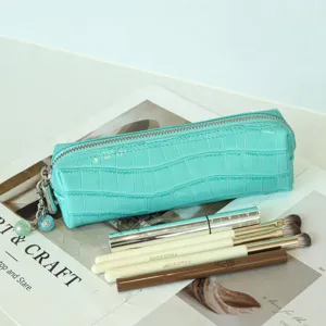 Premium crocodile grain cowhide cosmetic bag, stylish zipper pouch and travel organizer.